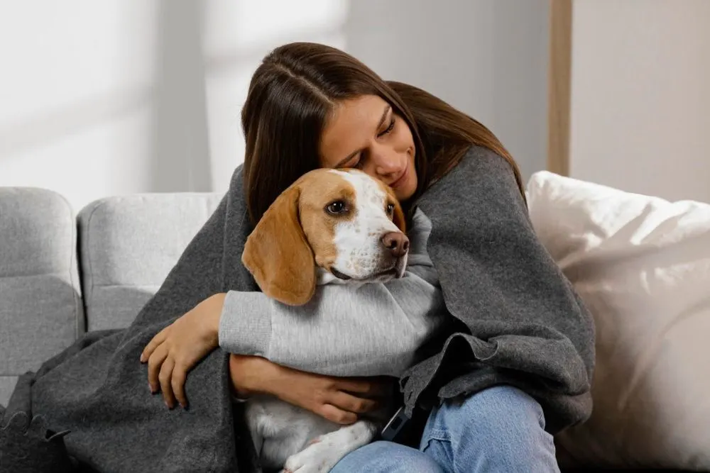girl hugging dog